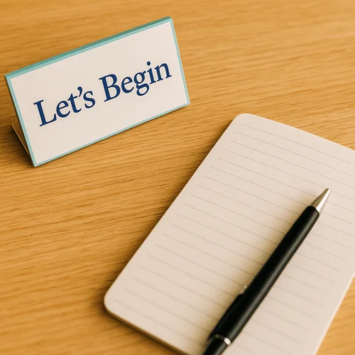 Notebook and pen beside a 'Let's Begin' sign, representing a smooth start to therapy sessions