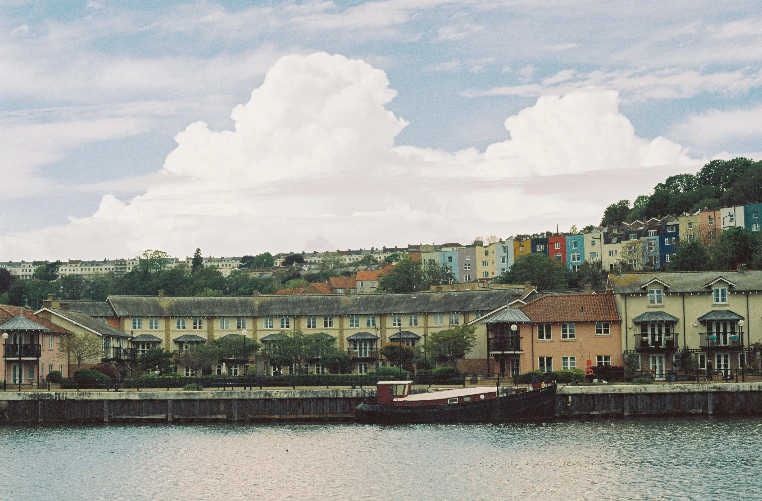 Bristol’s Floating Harbour, with the coloured houses of Cliftonwood on the hill above