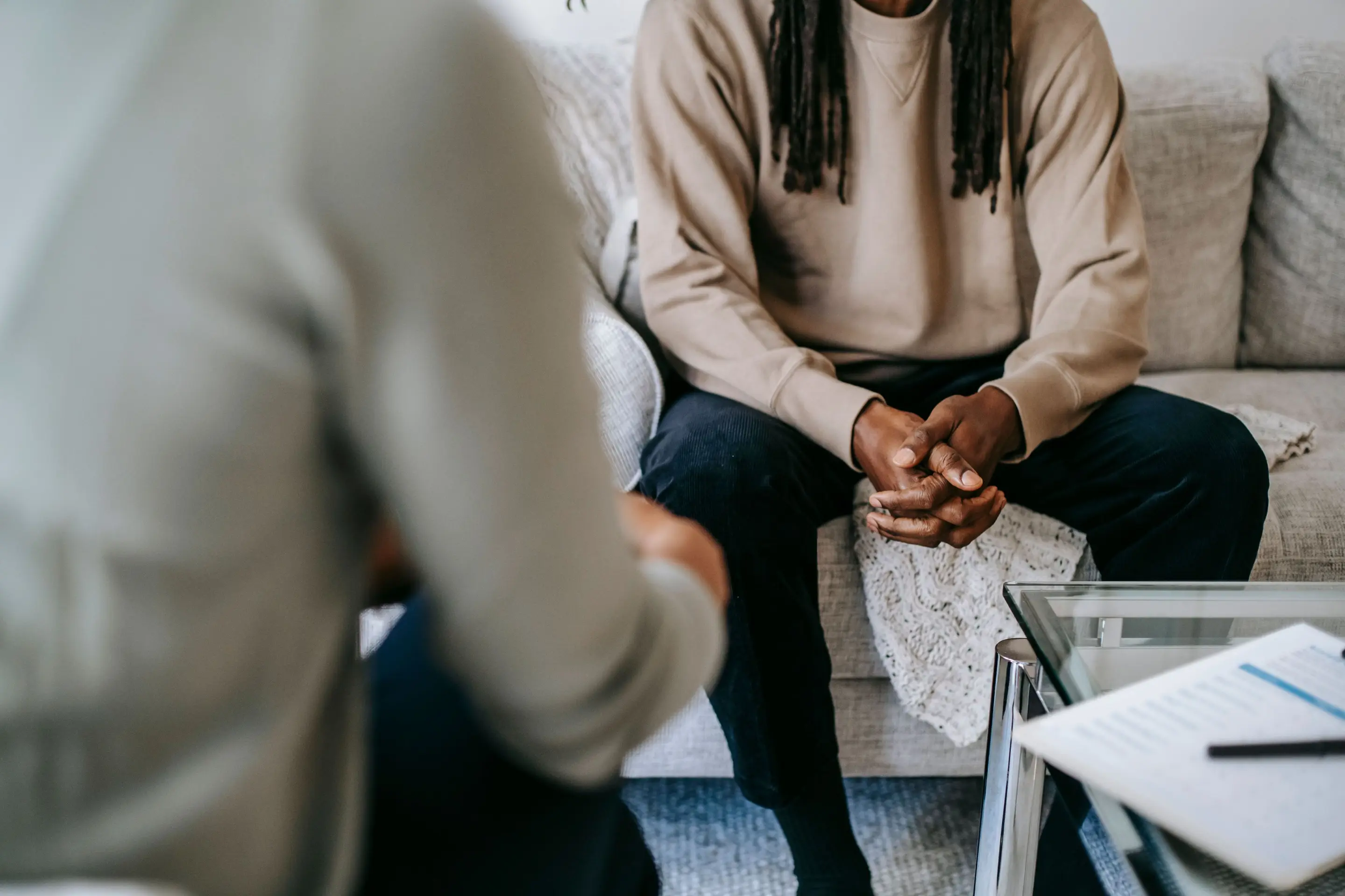 A client talking with a therapist in a calm room